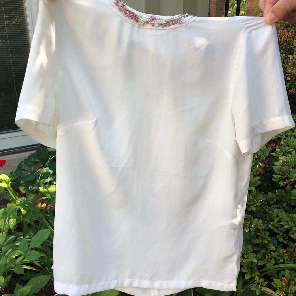 Fitted white blouse with jeweled accent collar